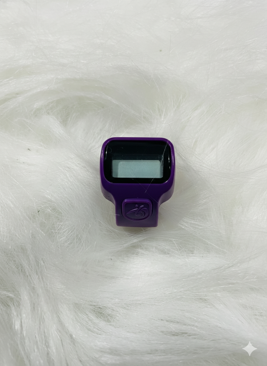 Close-up view of dark blue tasbeeh counter ring showing digital display and button controls